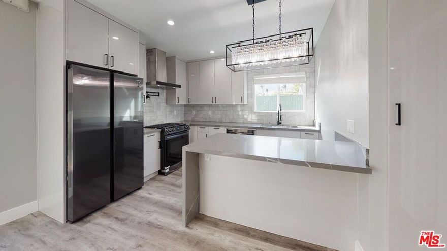 Welcome to your dream home in the heart of Mid City Heights, Los Angeles! This stunning, newly renovated 1-bedroom apartment showcases high-end finishes and a modern design that perfectly blends elegance, comfort, and functionality. Step inside to an inviting, light-filled living space featuring brand-new stainless steel appliances, including a counter-depth refrigerator that maximizes both space and style. The amazing kitchen island serves as the focal point  ideal for meal prep, casual dining, or entertaining guests. With sleek cabinetry, modern hardware, and an open layout, the kitchen offers a perfect balance of luxury and practicality. The bathroom has been completely upgraded, featuring LED lighting and a luxurious dual-shower setup with two shower heads creating a spa-like retreat designed for total relaxation and comfort. Every detail has been carefully chosen to elevate your lifestyle, from the premium finishes to the bright, airy flow throughout the apartment. This home also includes convenient parking and water, making your living experience even more effortless. Nestled in a prime Mid City Heights location, you'll be just minutes from The Grove, LACMA, Beverly Hills, and some of Los Angeles' most popular restaurants, cafes, and boutiques. Enjoy the best of both worlds the vibrancy of city life paired with the tranquility of a charming residential neighborhood.Don't miss the chance to make this beautiful Mid City Heights apartment your new home. With its luxury upgrades, designer features, and unbeatable location, this is modern Los Angeles living at its finest.