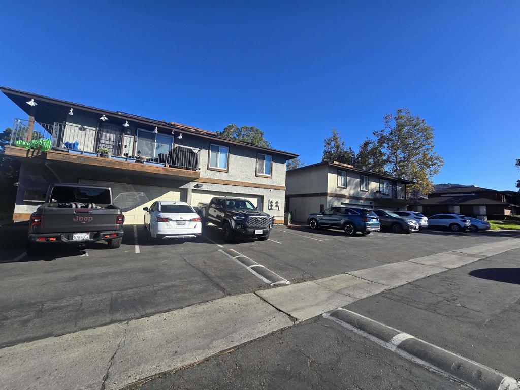 Discover this beautifully appointed 2-bedroom, 1-bath upper end unit condo, offering both comfort and convenience. Enjoy a 1 car locked garage space, practicality of an in-unit washer and dryer, and the rare benefit of three dedicated parking spots. The home is ideally situated with easy access to the 67, 8, and 52 freeways, as well as public transportation options for effortless commuting. The community features lush greenbelts, a sparkling pool for relaxing afternoons, and a fun rock area, creating a welcoming and vibrant neighborhood ambiance. This is a perfect opportunity to enjoy serene living with all the amenities you desire, including an oversized living area, separate dining room, full sized washer and dryer and large bedrooms.