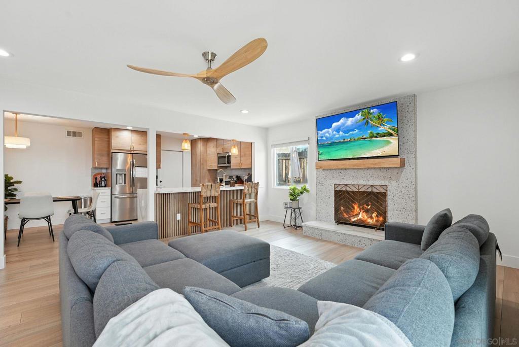 Santee living at its finest! Fully remodeled 3-bedroom, 2-bath home with a bonus room, upgraded from top to bottom with hand-selected finishes. Ample space for all your toys—room for a 35-ft toy hauler behind the side gate plus boat parking in the driveway. Brand-new central A/C, ceiling fans in every room, and blown-in attic insulation keep the home efficiently cool. Open floor plan with separate living and family rooms, spa-like bathrooms, and a light-filled primary suite. Modern kitchen with custom cabinets, premium hardware, sleek countertops, and new stainless steel appliances. Additional upgrades include a new roof, dual-pane windows, high-grade luxury vinyl plank flooring, and a terrazzo-tiled wood-burning fireplace.