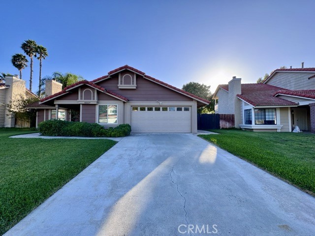 Welcome to this stunning single story home in Rainbow Canyon, nestled in the heart of Temecula! This beautifully maintained home features 4 spacious bedrooms and 2 upgraded bathrooms, and truly shows like a model home. Enter inside to find upgraded plank flooring, a neutral paint scheme, and a thoughtful layout with modern touches throughout. The inviting living room boasts a cozy fireplace and large windows that let in plenty of natural light. The adjacent kitchen overlooks the backyard and dining area, and features quartz countertops, a deep sink, stainless steel appliances (including a refrigerator), and ample cabinetry for extra storage. Down the hallway, you’ll find all bedrooms, both bathrooms, and the laundry room. Each bedroom is generously sized. The hall bathroom includes a shower/tub combo, while the primary suite is a true retreat, featuring two oversized closets, a sliding door leading to the backyard, and an ensuite bathroom with dual sinks and a spa like walk-in shower. The backyard is beautiful with two covered patio areas, lush green grass, and mature trees providing privacy. Don’t miss your opportunity to rent this beautiful, move-in-ready home in one of Temecula’s most desirable communities!