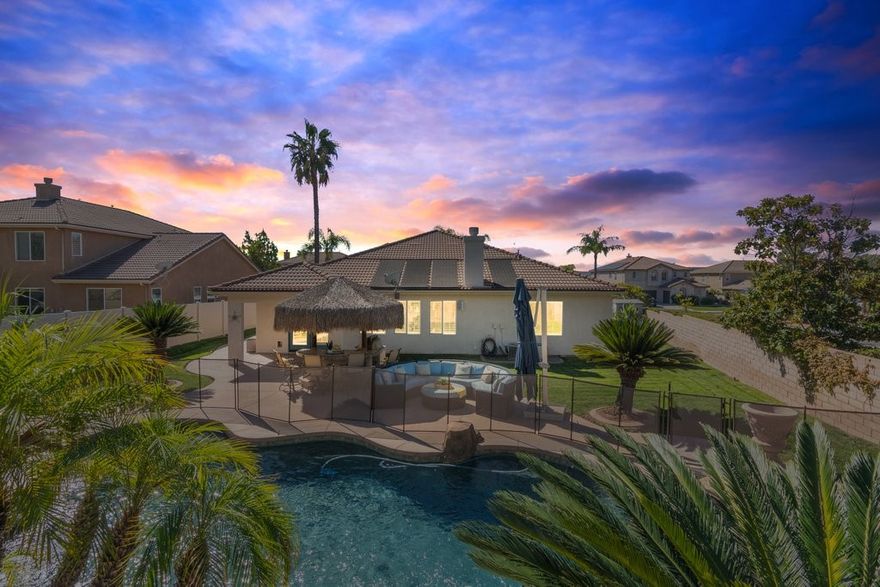 Cancel the vacation ticket! Discover this resort-style living in this rare single-story home on a 0.35-acre corner lot in the Golf Club at Rancho California. Designed for flexibility and function, this property includes a private casita with its own exterior entrance and full bath, perfect for guests, extended living, or a private office. The main residence offers three bedrooms plus a versatile den, along with a luxurious primary suite featuring a double walk-in shower, heated towel rack, and custom walk-in closet.

Inside, you’ll find fresh interior paint, crown molding, and an open-concept floor plan that connects the kitchen, dining, and living areas. The kitchen showcases shaker-style cabinetry, granite countertops, dual ovens, a five-burner cooktop, and designer lighting, ideal for everyday cooking and entertaining alike. The formal dining area is currently styled as a billiards lounge, offering a seamless transition for gatherings and celebrations.

Step outside to your private backyard oasis with a sparkling pool featuring a slide and water features, an attached spa, pergola-covered seating, lush tropical landscaping, and a built-in BBQ beneath a palapa bar. Additional upgrades include home solar, pool solar, a central vacuum system, epoxy-finished garage floors, and a large potential RV location. An outdoor shed provides extra storage space for tools and seasonal gear.

This property combines privacy, space, and convenience, located just minutes from shopping centers, top-rated schools, and major freeways. With no HOA and low taxes, this exceptional home delivers the best of Murrieta living in one of the area’s most desirable golf-course communities.