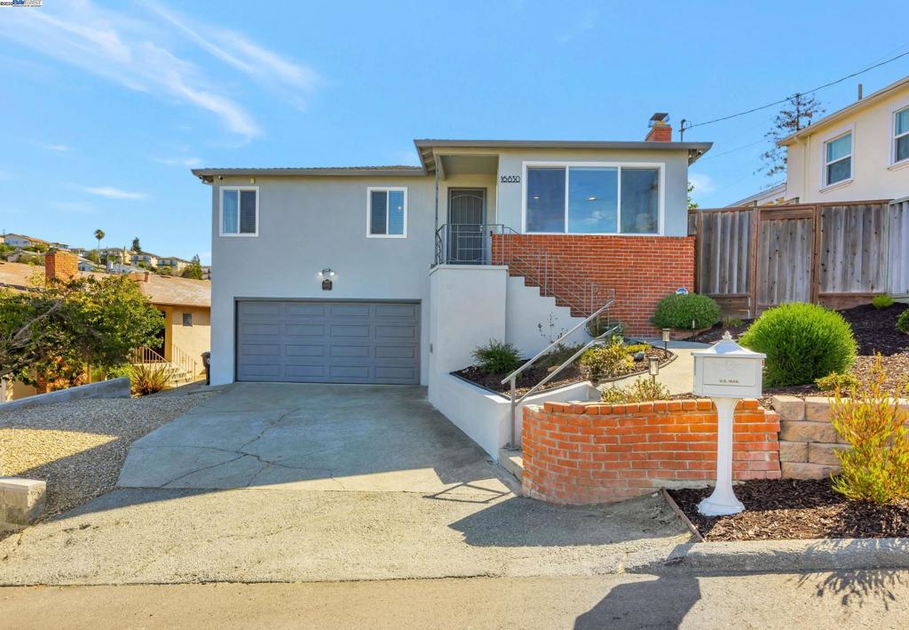 Breathtaking Bay views and lots of natural light await in this move-in ready 3-bedroom, 2-bath home with 1,701 sq. ft. of comfortable living space. You’ll love the updated kitchen and bathrooms, new carpeting, fresh interior and exterior paint, hardwood floors in the bedrooms, and attached 2-car garage. Additionally, the flexible downstairs area has a full bath and a separate side entrance, perfect for multi-generational living, guest quarters, or rental income. Enjoy Bay views from the living room and bedrooms, or relax in the low-maintenance backyard with Premium Artificial Turf. Situated on a 4,606 sq. ft. lot, this home blends style, comfort, and convenience, just minutes from shopping, dining, BART, and freeway access.