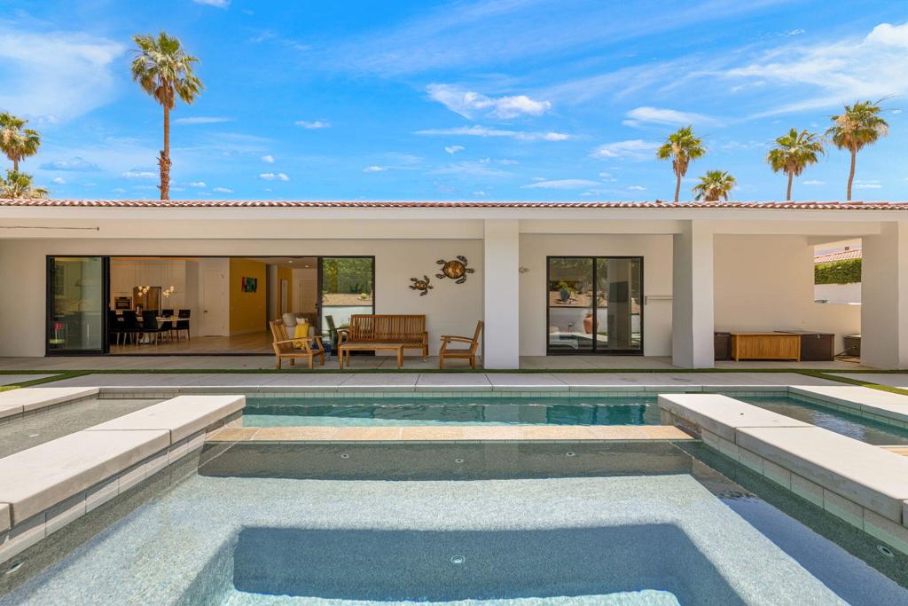 Discover luxury living in this exquisitely remodeled, contemporary 4-bedroom home. The heart of the house is a chef's dream kitchen, featuring state-of-the-art GE Cafe appliances and a 6-burner gas stove that invites culinary creativity. Imagine the gourmet meals you'll prepare, surrounded by friends and family. But the culinary delights don't end in the kitchen--step outside to your BBQ station and enjoy outdoor dining in your private oasis. While meals are grilling, perfect your golf game on your very own putting green, take a refreshing swim in the sparkling pool, or unwind in the serene hot tub. With three stylish guest bedrooms and a luxurious primary suite, this home comfortably sleeps 8, making it perfect for gatherings and getaways. Experience the expansive layout, relaxing outdoor spaces, and endless entertainment that await you. Rent this beautiful home to truly appreciate its charm and comfort firsthand.