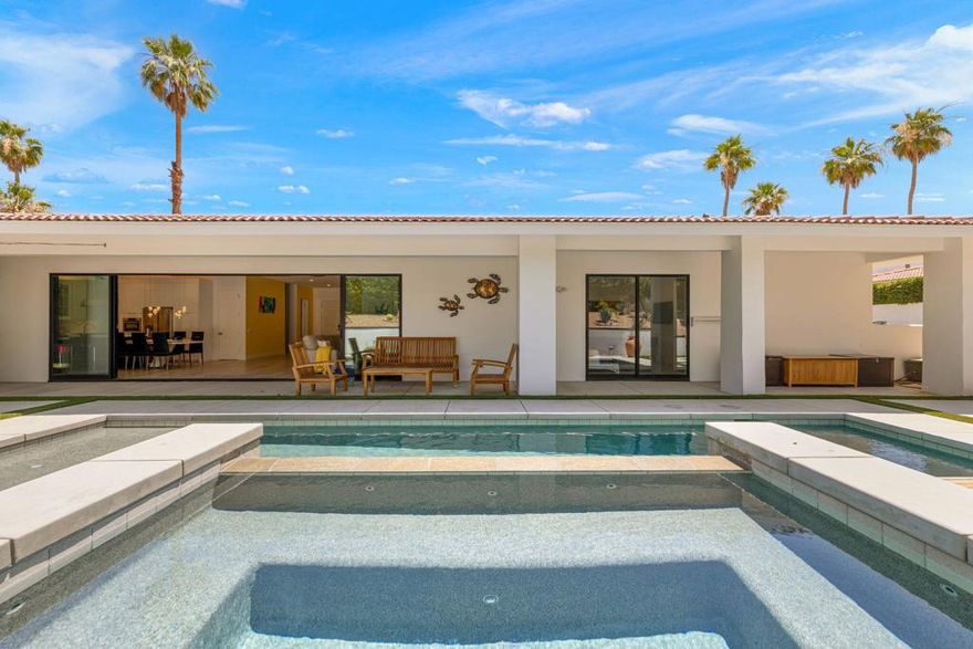 Discover luxury living in this exquisitely remodeled, contemporary 4-bedroom home. The heart of the house is a chef's dream kitchen, featuring state-of-the-art GE Cafe appliances and a 6-burner gas stove that invites culinary creativity. Imagine the gourmet meals you'll prepare, surrounded by friends and family. But the culinary delights don't end in the kitchen--step outside to your BBQ station and enjoy outdoor dining in your private oasis. While meals are grilling, perfect your golf game on your very own putting green, take a refreshing swim in the sparkling pool, or unwind in the serene hot tub. With three stylish guest bedrooms and a luxurious primary suite, this home comfortably sleeps 8, making it perfect for gatherings and getaways. Experience the expansive layout, relaxing outdoor spaces, and endless entertainment that await you. Rent this beautiful home to truly appreciate its charm and comfort firsthand.