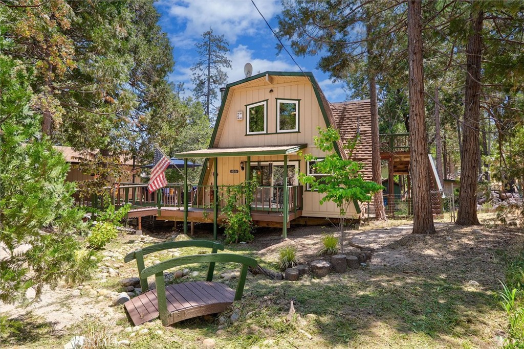 Welcome to your serene mountain escape in the beautiful Bass Lake Heights neighborhood! This unique flat top A-frame cabin blends rustic charm with modern upgrades, making it the ideal addition to your investment portfolio or the perfect second homejust minutes from scenic Bass Lake. Featuring 2 bedrooms and 2 bathrooms across 1,575 sq ft, this thoughtfully updated home is in prime condition to continue operating as a successful short-term rental. High, beamed ceilings and a spacious loft with an attached side deck create an airy, open feel. Stay cozy during chilly mountain months with both a wood-burning stove on the main floor and a propane stove in the loft, while central air keeps things cool during summer. The inviting wrap-around porch includes a fully screened area in the backperfect for relaxing or entertaining guests. You or your guests can even take a short hike down to Bass Lake. This well-maintained vacation rental is ready to keep generating returns for its next owner. Don't miss outreach out today!