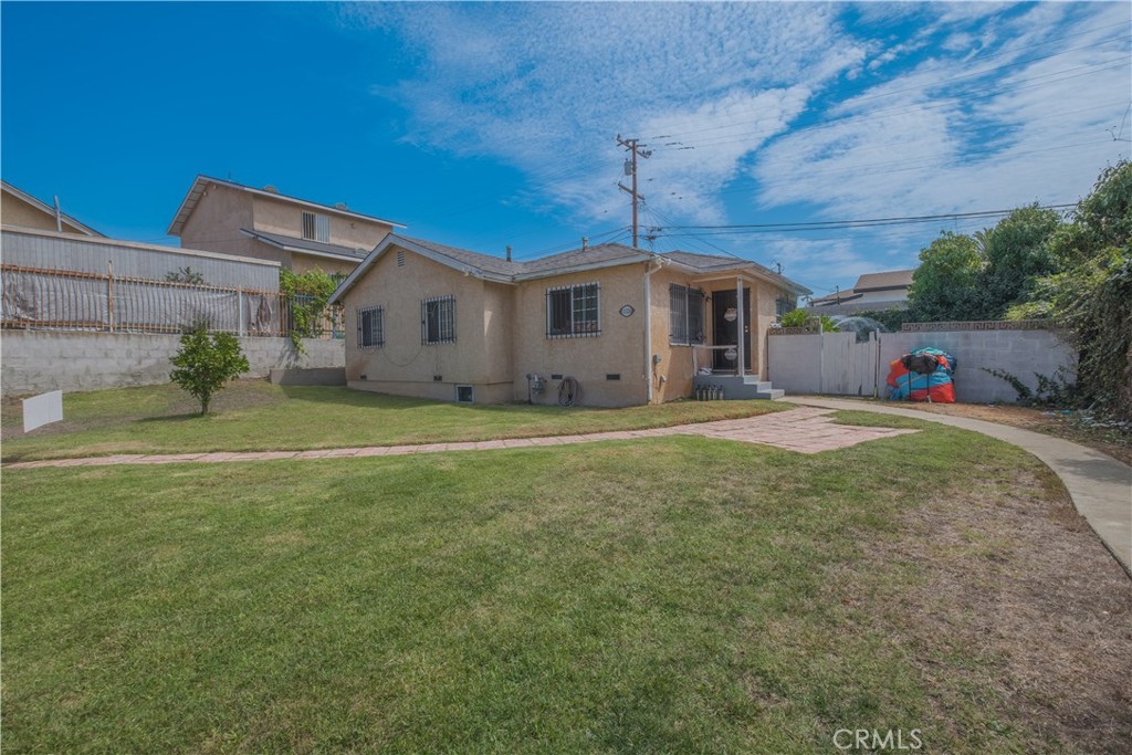 Rare opportunity! This property sits on a generous 9,000 sq. ft. lot with zoning that allows for up to seven additional housing units, making it an incredible investment for developers or those looking to expand. The home has been maintained with key updates including repiped plumbing, kitchen and flooring renovations, ceramic tile living spaces, and brand-new waterproof vinyl plank flooring in the bedrooms and hallway. A roof sealer was also applied only a few years ago for added protection.
The lot provides exceptional functionality with a two-car garage, additional parking, and alley access. Situated in a Transit Oriented District, public transportation options including major bus lines and Metro Rail are within easy reach. The quiet residential setting, proximity to Southwest Los Angeles College, and existing improvements like a sprinkler system and outdoor patio add even more value.
Whether you’re searching for a comfortable residence with room to grow or a project with serious development potential, this property offers the best of both worlds.