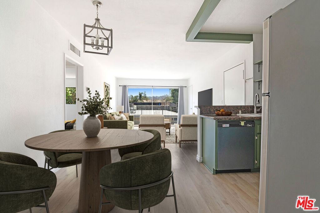 Welcome to this beautifully updated and uniquely designed 3-bed, 3-bath condo in a clean, contemporary Sherman Oaks complex. This rare corner-floor plan offers unmatched flexibility ideal for roommates, multi-generational living, rental, or an in-law setup. A second private entrance leads to an additional living area with a kitchenette, third bedroom, and full bath perfect as a guest suite or private retreat. Main entrance leads to this light-filled unit featuring spacious bedrooms with large closets, sleek modern bathrooms, and an open-concept layout that flows seamlessly from the dining area to a well-appointed kitchen with granite countertops and stainless steel appliances. There's even a dedicated space ready for an in-unit stackable washer and dryer. Enjoy your morning coffee or unwind in the evening on your private balcony with peaceful views. The gated complex is meticulously maintained and includes a swimming pool, dry sauna, and community laundry room. Subterranean tandem parking for two cars is included, with plenty of street parking available. Just minutes from Ventura Blvd, the 101 and 405 freeways, Van Nuys Middle School, Westfield Fashion Square, Trader Joe's, Whole Foods, and a wide array of restaurants, entertainment, and shopping destinations. (photos are digitally staged)