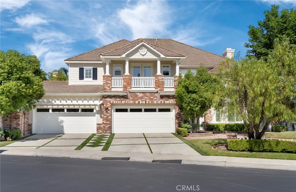 MOTIVATED SELLER! $90,000 PRICE REDUCTION! Welcome to this newly remodeled luxury estate, situated behind a second private gate in the prestigious Oak View enclave of the world-renowned equestrian community of Coto de Caza. This exquisite 5-bedroom, 4.5-bathroom residence has been thoughtfully transformed into a refined sanctuary, offering breathtaking mountain views and exceptional privacy.
Step into the grand foyer with soaring ceilings that seamlessly connect to a modern living room, anchored by a striking marble-accented fireplace, and a spacious home office. The formal dining room is adorned with white embossed wainscoting, creating a bright and elegant space for entertaining.
The heart of the home is the gourmet kitchen, featuring a stunning oversized waterfall island and matching gray-green marble backsplash. Designed for the culinary enthusiast, the kitchen is equipped with double refrigerators, dual ovens, a 6-burner stove, and a designer range hood. A convenient ground-level bedroom with a private en-suite bath, a well-appointed laundry room, and a spacious four-car garage complete the main floor.
Upstairs, the primary suite is a true retreat with a cozy fireplace, custom curtain boxes, and a lavishly upgraded bathroom. Enjoy a spa-like experience with a glass-enclosed shower, freestanding soaking tub, dual sinks with smart mirrors, and a custom walk-in closet. The second level also includes three additional bedrooms, a dedicated media room, and a spacious loft for additional living or recreation space.
The expansive backyard is an entertainer’s dream, featuring a custom-designed pool and spa surrounded by intricate brickwork, a built-in barbecue and bar, a fireplace, and multiple seating areas—perfect for hosting or relaxing while taking in the sweeping mountain vistas.
This exceptional home offers elevated living with thoughtful upgrades, luxurious finishes, and a setting that feels both private and grand.