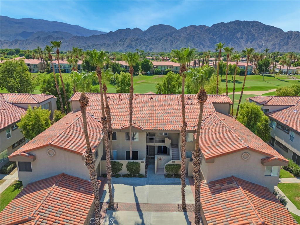 Turnkey fully furnished 2BD/2BA upper-level condo in PGA West’s Palmer Private—offering stunning mountain and fairway views! This light-filled unit features an open-concept living/dining space, high ceilings, and an updated kitchen. Enjoy serene sunsets from the spacious balcony overlooking the 5th hole. With a detached 2-car garage, community pools/spas, and short-term rental potential, this home is ideal for vacation or investment.