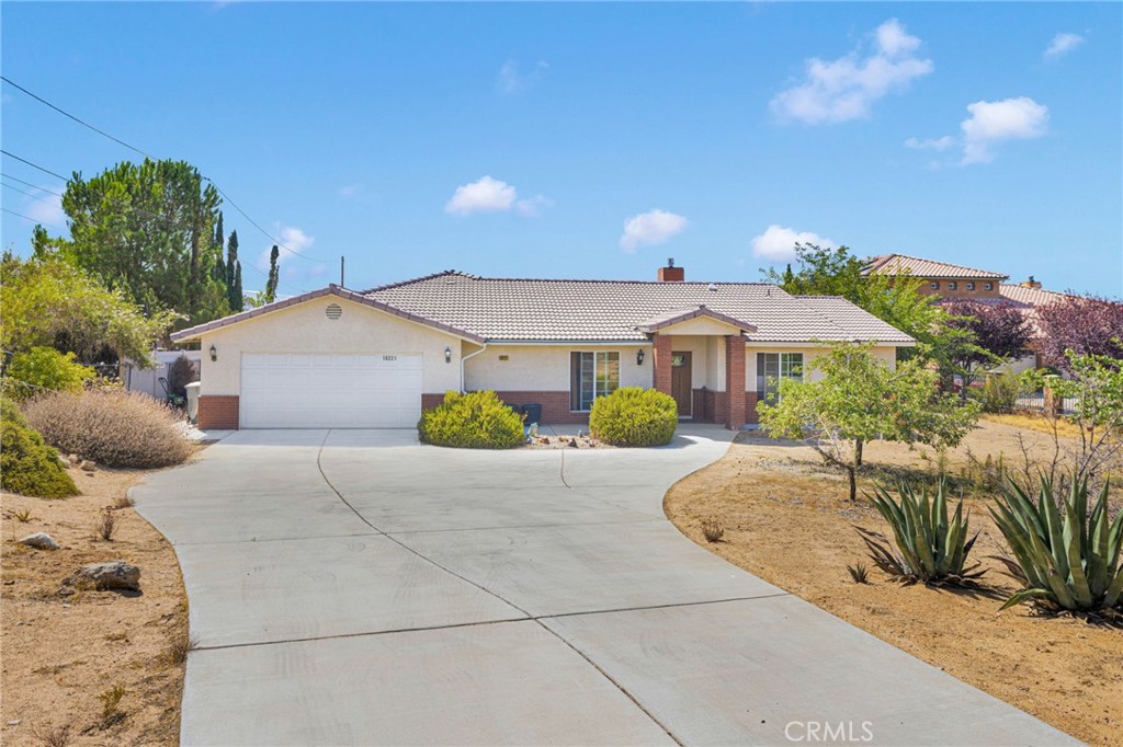 Proudly offered for the first time, this CUSTOM-BUILT home—crafted with care by its original owners—offers a rare combination of thoughtful DESIGN, FUNCTIONALITY, and BREATHTAKING VIEWS. The property boasts a 2400+ sqft residence that overlooks the Hesperia Golf Course, providing a peaceful backdrop to your everyday life. The well-constructed layout features 3 generously sized bedrooms, each with an ENSUITE BATHROOM and WALK-IN CLOSET, offering both privacy and convenience for every member of the household. A versatile BONUS ROOM can be tailored to your needs, whether as a 4th BEDROOM, a HOME OFFICE, or a FLEXIBLE SPACE for hobbies or guests. The heart of the home is an OPEN-CONCEPT living area, seamlessly connecting the kitchen, dining, and living spaces—perfect for entertaining or simply enjoying the flow of daily life. The kitchen is a chef’s delight, featuring RICH WOOD CABINETRY, GRANITE COUNTERTOPS, a LARGE ISLAND, a BREAKFAST BAR, and a SPACIOUS PANTRY. Step into the bright and tranquil SUNROOM, where expansive windows frame picturesque views of the backyard and the golf course below, creating an ideal spot to relax and unwind. Various SKYLIGHTS throughout keep the home bright and unique HEATED FLOORING keep temps comfortable all year round. Not one, but TWO extra large UTILITY CLOSETS give plenty of space for storage and organizing. The attached garage is fully finished with enclosed drywall and includes a very functional LAUNDRY AREA equipped with hook ups, storage cabinets, and a utility sink. The landscaping in the front yard includes MATURE FRUIT TREES that are not just sustainable but also create a natural sense of privacy. These kind of properties are a RARE FIND and the VIEW you must see in person.