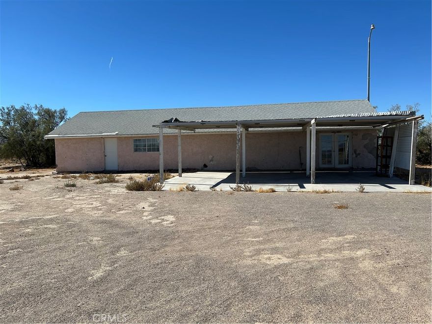 Turn off Valley Center Rd in Newberry Springs into a long driveway to this three Bedroom, Three Bath 1423 sq. foot home on five acres. Rehab was started and not finished. A small building sits on the South side where a one room and bathroom was started. A well house and a shed. Several RV hookups for your friends. Well is located in its own housing. A view of the surrounding mountains. 

 Newberry Springs is a small community located about thirty minuets past Barstow, Sandwiched between the I-15 and I-40 . Two hours before Las Vegas or Laughlin. Mostly agriculture, our farmers grow pistachios, alfalfa and live stock. We ride horses, ATVs, dirt bikes and hike in the surrounding Mountains in our Valley. Six private communities on Lakes are also here. And large solar plant. 

 Two schools with individual attention, Family Center with Café, two truck Stops, two family type bars and community center with park. 

 Come on out and see us sometime. This spacious five acres is a must see. Call me or bring your own agent.