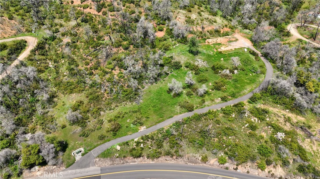 Don’t miss this rare opportunity to own a gorgeous 5-1/2-acre parcel just minutes from the charming historic town of Mariposa and only 1 mile from Highway 140. It is less than an hour to the iconic Arch Rock entrance of Yosemite National Park. A beautifully paved driveway leads you up to a private building pad, perfectly positioned to take in breathtaking 180° mountain views. This property once held a cherished home of 30 years, lost in the Oak Fire, but it’s ready for a fresh start.Major infrastructure is already in place: PG&E has installed underground electricity, the septic system has been recently inspected and is in working condition (with minor parts needing replacement), and two wells on site offer great potential with repair.
Whether you’re looking to build your dream home, a peaceful getaway, or a long-term investment, this parcel offers endless possibilities in a truly unbeatable location.