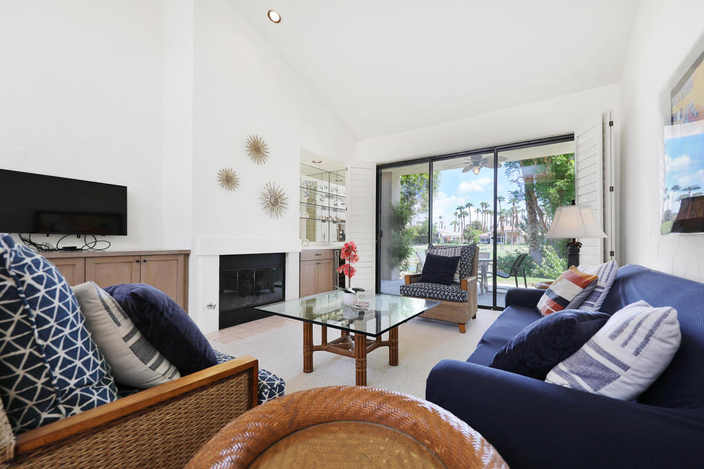 Welcome to this beautifully remodeled Champion 1 condo, ideally located on the 7th fairway of the Palmer Private Course with no cart paths--offering a serene, private setting. This 2-bedroom, 2-bath home is perfectly positioned with stunning lakefront views, morning sun, and afternoon shade, creating the ultimate outdoor living experience.Step inside to find an open, light-filled floor plan with soaring ceilings, large windows, and plantation shutters for added privacy. The remodeled kitchen is thoughtfully designed to maximize space and overlooks the charming courtyard. The primary bath has been tastefully updated with modern finishes, and brand-new carpet makes the home feel fresh and inviting.Enjoy peaceful mornings on the patio with coffee overlooking the lake and fairway, or dine al fresco in the evenings in the cool shade--perfect for entertaining or simply relaxing.Sold turnkey furnished, this home is move-in ready and ideal as a vacation getaway, rental property, or full-time residence. Residents enjoy access to multiple pools, world-class golf, tennis, dining, music festivals, and art events--everything the La Quinta lifestyle has to offer.