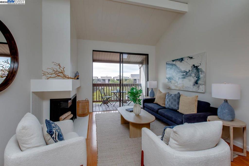 Located directly across the street from Alameda's beach and shoreline, this newly updated waterfront condo is part of The Willows HOA community and features 2 bedrooms, 1.5 bathrooms and a living room/dining room/kitchen great room. Features of this sunny 4th-floor home include a durable wood-style laminate floor on the main upper level, and new carpeting in the lower level bedrooms. Updates include new light fixtures, new quartz kitchen counters + a new stainless steel range + dishwasher, fresh interior paint + updated/refreshed bathrooms. Details include a dramatic vaulted great room ceiling, a fireplace + a balcony off the great room with partial water views. In-unit washer/dryer hookups. One covered parking space is assigned to the unit. Owners can take advantage of the HOA's many amenities such as an attractive clubhouse, a large pool + an in-ground spa, and a fitness center. The convenience of the home's close proximity to Trader Joe's and the South Shore Center's many attractions can't be overstated, while Washington Park and downtown Park St are just a few minutes away. With the sights and sounds of the SF Bay at your doorstep, this home truly feels like resort-style living at its best!