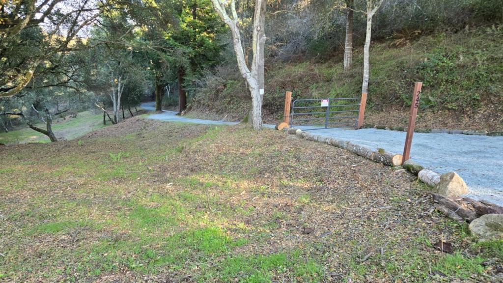 Gently sloped 4.7 acre lot in a beautiful and serene setting. Revive previously submitted (expired) house plans or better yet sit down with your architect and design the perfect home for you and your family. Lot has: engineered driveway; water well; plans for septic system; and electricity at the street. Park-like setting features spectacular redwood trees; ferns, wild mushrooms, and views of the Larkin Valley. Possible horse lot. Note: Gillette Rd is narrow but has very little traffic.