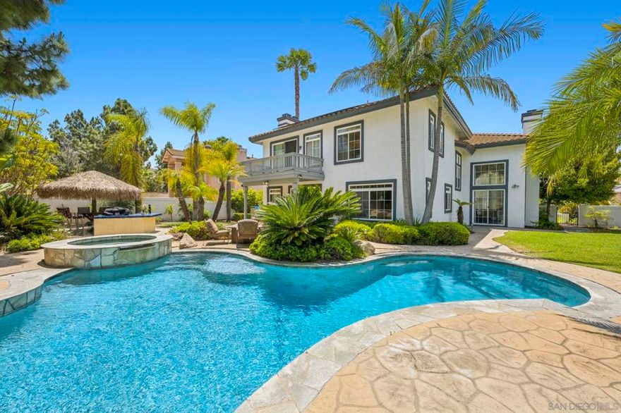 Welcome to a sanctuary of luxury in the heart of Rancho Del Rey, Chula Vista, where every detail of this exquisite residence invites you to experience timeless elegance and comfort. Spanning nearly 4,300 square feet, this stunning home offers 5 spacious bedrooms and 4 1/2 beautifully designed bathrooms, each crafted to provide a seamless blend of style and relaxation. At the heart of the home, a gourmet kitchen awaits—featuring premium appliances and exquisite quartz countertops, perfect for both grand entertaining and intimate family gatherings. Step into the expansive living areas, where soaring ceilings and three handcrafted fireplaces create a warm, inviting ambiance. The master suite is a private retreat, complete with a wrap-around balcony offering views of the meticulously landscaped pool and spa. Indulge in the spa-like master bath, featuring a soothing jacuzzi and spacious his-and-hers closets. For those who appreciate a distinguished workspace, the home boasts an elegant office wrapped in rich wood paneling from floor to ceiling—an ideal setting for deep focus, creative pursuits, or quiet contemplation. Outside, your personal oasis awaits. A sparkling pool with a cascading waterfall, a built-in grill, and a charming palapa set the stage for unforgettable al fresco dining and entertaining. This serene space offers the perfect escape to unwind and soak in the beauty of your surroundings. This home offers the perfect balance of privacy and accessibility. No HOA. No Mello-Roos. 20 Minutes from downtown San Diego and the Mexican border.