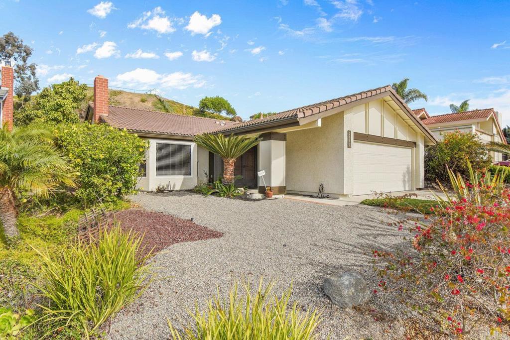 Welcome to North Clairemont! This beautifully maintained single-story home combines comfort, charm, and thoughtful updates. A bright double-door entry opens to a spacious living room with a marble gas fireplace, bay window, and newer carpet. The updated kitchen features quartz countertops, stainless steel fridge, a large pantry, and a convenient pass-through to the dining/family room—perfect for everyday living and entertaining. Sliding doors lead to a private backyard oasis with mature fruit trees (tangerine, persimmon, pomegranate, avocado) and seasonal grapevines. Down the hall, you’ll find 3 serene bedrooms plus a versatile 4th bedroom ideal as an office, den, or playroom. The primary suite includes a walk-in closet and walk-in shower; the second bath features a relaxing shower/tub. Additional highlights: •Fresh paint, newer carpet & blinds •Energy-efficient windows & skylights • New attic insulation •Attached 2-car garage with storage, washer/dryer & 2nd fridge. New kitchen cabinet handles, new recessed lighting & new light switched and outlets. Move-in ready and conveniently located near Alcott Elementary, parks, shopping, and more—this home is ready to make lasting memories! Available now.
