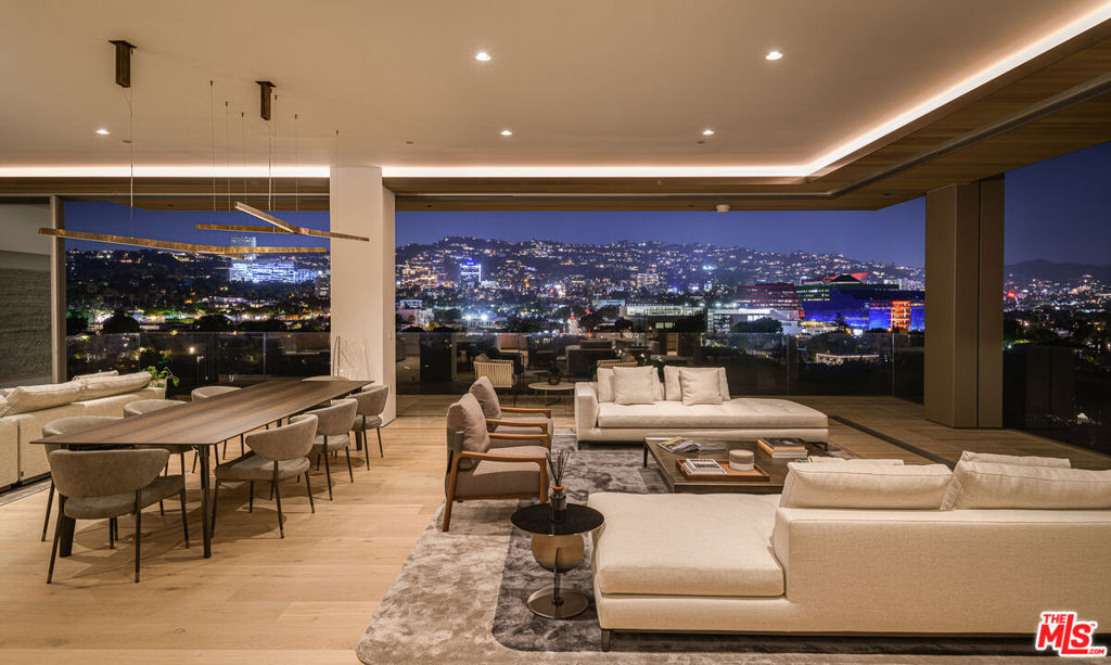 One-of-a-kind, custom four bedroom combo residence. Immediate closing: building is fully operational and staffed and move-in ready! 8899 Beverly is world-renowned architects Olson Kundig's "Love Letter to Los Angeles". Residence 7BE is custom-built combination residence, and has a massive primary suite with sitting room/office facing north with the most brush form views of the hills. The primary suite also opens entirely to the outdoors allowing you to enjoy the views from every room and from your terraces. The AD 100 architect's Leed Gold-certified masterpiece culminates in the finest new development to hit the Los Angeles skyline. The Tower Residences feature expansive views across the Los Angeles horizon and encompass LA's most iconic landmarks. The sliding walls of the extraordinary, Swiss-made, Vitrocsa glass system bring the outdoors into each residence. The finest, hand-selected, materials include travertine throughout the residences and common areas, Sub-Zero, Miele and Gaggenau appliances, Calacatta Gold marble, bronze residence entry surrounds and custom door handles of bronze and hand-stitched leather. Ceiling heights soar up to 11 feet, including the custom recessed and cove lighting. Building amenities include 24-hour lobby staff, concierge, fitness center outfitted by Techno Gym and private studio space. 8899 has an extreme focus on privacy and exclusivity for its residents. Experience over a quarter-acre of outdoor space, lushly landscaped alongside a resort-style pool, oversized spa, garden seating with fireplaces and custom outdoor kitchen and dining. Enjoy short walks to premier dining and shopping, including The Ivy, Craig's, Bristol Farms, Chanel and more. Experience the exclusivity and luxury of Olson Kundig in this ultra-prime, walkable, Los Angeles location. 8899 Beverly is a feat never to be accomplished again. Please note that not all photographs represent the listed residence.