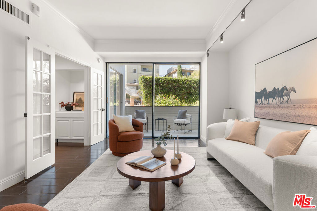 Modern Corner Retreat with Expansive Outdoor Space in the Heart of Hollywood Experience the perfect blend of luxury and location at 7250 Franklin Avenue, Unit 107. Just steps from iconic Runyon Canyon, the TCL Chinese Theatre, and an array of Michelin-starred dining including Providence and Gwen this 2-bedroom, 2-bath residence offers 1,260 square feet of sophisticated living. Inside, a bright and open floor plan welcomes you with elegant porcelain tile hardwood floors and a sleek, modern kitchen boasting a sprawling quartz island and high-end finishes ideal for both culinary pursuits and effortless entertaining. As a rare corner unit, this home redefines indoor-outdoor living. Enjoy a private patio, a covered balcony, and a lush, fenced-in yard, culminating in a 1,000+ square foot outdoor oasis perfect for sun-soaked afternoons or intimate gatherings. Franklin Towers elevates the lifestyle further with unmatched amenities: valet guest parking, comprehensive security, a resort-style pool and spa, steam rooms, dry saunas, a yoga room, and an upgraded clubhouse with a full chef's kitchen. This is more than a residence it's a retreat in one of Los Angeles' most coveted locations.