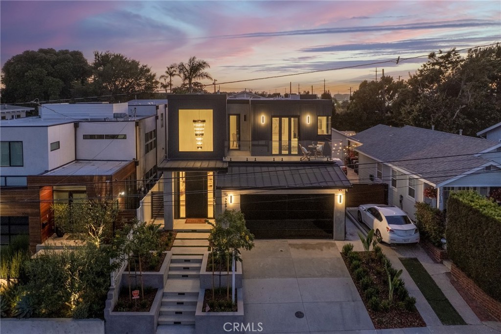 Welcome to 3609 Oak Avenue, a striking new construction in the heart of Manhattan Beach. This modern 4-bedroom, 4-bathroom home blends sleek design with everyday functionality. Inside, floor-to-ceiling windows flood the space with natural light, while clean lines and contemporary finishes create a polished, airy atmosphere. The open-concept living area flows effortlessly into a state-of-the-art kitchen featuring Dacor appliances, complete with a walk-in pantry and an oversized island. The dedicated laundry room adds convenience, and each bathroom is thoughtfully appointed with designer fixtures. A dramatic waterfall wall serves as a statement feature, and the entertainer’s backyard offers seamless indoor-outdoor living, ideal for gatherings or quiet relaxation. Every detail of this brand-new home has been curated for comfort, style, and sophistication.