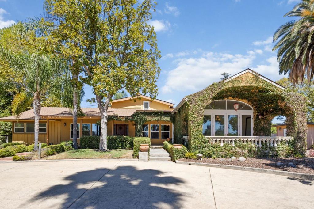 Welcome to 3303 Pope Avenue, a one-of-a-kind Mediterranean retreat in Sacramentos Arden-Arcade community. Situated on a 0.72-acre lot framed by soaring palms and your own private vineyard, this 3,200 sq ft home blends Spanish-style charm with everyday comfort. Inside, the home offers 3 bedrooms and 3 bathrooms, highlighted by a gourmet kitchen with granite counters, Viking range, Sub-Zero refrigerator, and custom finishes designed for entertaining. A wine cellar, Juliet balcony, and courtyard with fountain add to the Old-World character, while large windows invite natural light and views of the lush grounds. Step outside to enjoy rows of grapevines and multiple patios for relaxing or hosting. The property also includes a gated entry, and workshop shed for extra flexibility. Located steps from Del Paso Golf & Country Club and close to schools, shopping, and dining, this estate offers privacy, charm, and a lifestyle rarely found in Sacramento.