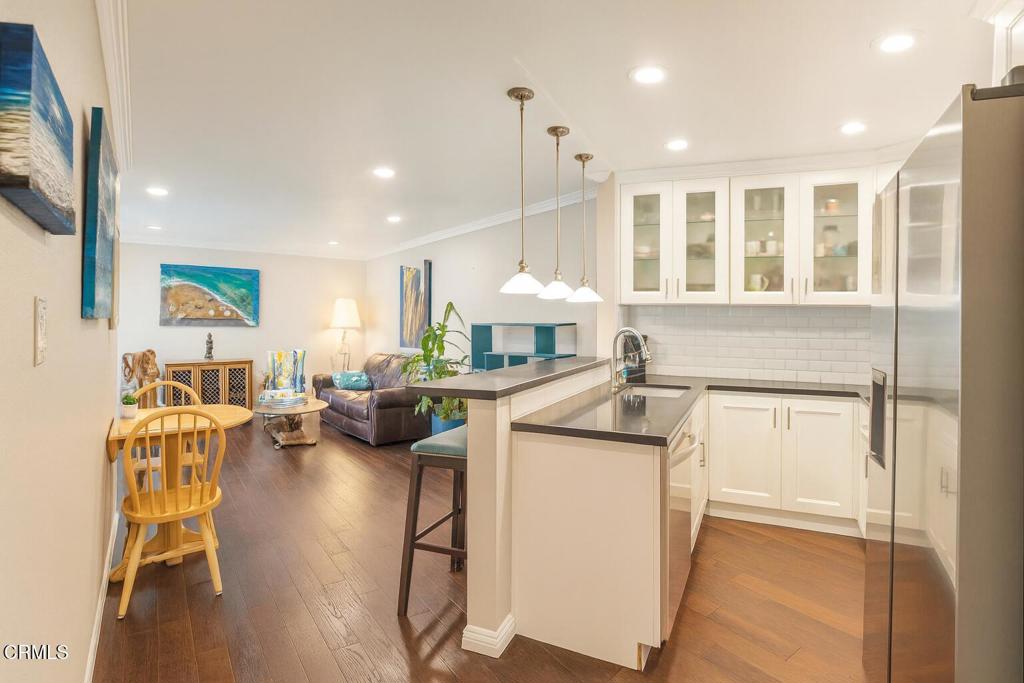 Enjoy waterfront living at its finest in this spacious 1-bedroom, 1-bathroom top-floor condo overlooking the beautiful Channel Islands Marina. Perfectly located just five minutes from the beach, shops, and restaurants, this home offers the ultimate blend of coastal charm and everyday convenience.Inside, the open-concept layout features a well-equipped kitchen with bar seating that flows into the living room. Sliding glass doors open to a private patio, where you can relax and take in sweeping marina views.Residents of this sought-after community enjoy resort-style amenities, including tennis courts, a clubhouse, a full gym, and access to a sauna in each locker room. Take advantage of three swimming pools--one heated year-round at the clubhouse and two heated seasonally--as well as a Jacuzzi and shared laundry facilities. One assigned underground parking space is also included.Appliances provided include a refrigerator (maintained by owner), microwave, electric range, and dishwasher. Washer and dryer are available in the community laundry room. Heating is included; however, there is no air conditioning or fireplace in the unit.Lease terms include tenant responsibility for electricity, while water, sewer, and trash are covered by the HOA. A $100 HOA move-in fee applies. Please note: no pets and no smoking are permitted.With unbeatable marina views, resort-style amenities, and proximity to the beach, 2901 Peninsula Rd #337 presents an exceptional opportunity to enjoy the very best of Oxnard's coastal lifestyle.