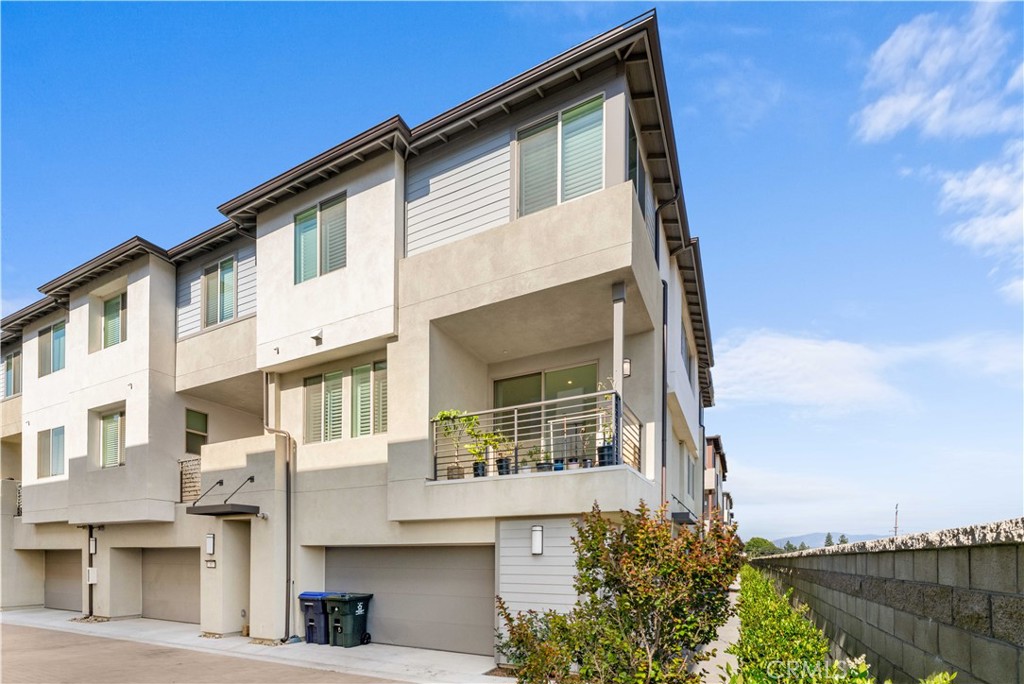 Welcome to your dream home in the all-new GATED community of beautifully designed CORNER Lot VIEW townhomes at Hudson in Placentia. This practically brand new 3 bedroom townhouse is move-in ready and boasts PAID-off Solar panels for energy efficiency and a tankless water heater for continuous hot water!! This most desired end-unit Comforting, cozy , LED lighting, and energy-saving Smart Home components—helping you save significantly on your utility bills. Inside, all the Wood flooring go through whole house, The master bedroom has a walk-in closet, providing ample
storage space for your wardrobe. The two and a half bathrooms are designed to provide you with a comfortable and luxurious experience. In addition to its impressive features, this dream home also includes an oversized 2 car garage with storage, providing ample space for your vehicles and any other belongings you may need to store. The home also boasts HOA amenities, including a playground, basketball court, beautiful landscaping, a recreation area, and a dog park, which all will be ready for enjoyment upon completion of the community development. You and your family can enjoy these amenities, making the most of your free time. The upgrades in this home are equivalent to $60,000, adding to its value and luxury. These upgrades will make your life easier and more comfortable, and add to the overall appeal of your new home. This is a rare opportunity to own a like-new townhouse in the beautiful Placentia area. Don't miss out on the chance to make this your dream home. Don’t miss your opportunity to live in this nearly new, energy-smart home in a thriving community!