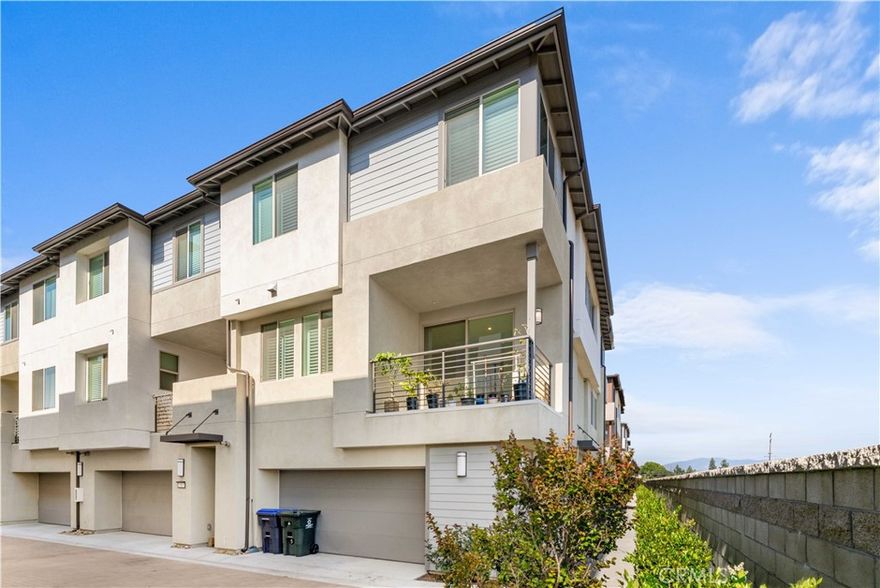 Welcome to your dream home in the all-new GATED community of beautifully designed CORNER Lot VIEW townhomes at Hudson in Placentia. This practically brand new 3 bedroom townhouse is move-in ready and boasts PAID-off Solar panels for energy efficiency and a tankless water heater for continuous hot water!!   This most desired end-unit Comforting, cozy , LED lighting, and energy-saving Smart Home components—helping you save significantly on your utility bills.  Inside, all the Wood flooring go through whole house, The master bedroom has a walk-in closet, providing ample 

storage space for your wardrobe. The two and a half bathrooms are designed to provide you with a comfortable and luxurious experience. In addition to its impressive features, this dream home also includes an oversized 2 car garage with storage, providing ample space for your vehicles and any other belongings you may need to store. The home also boasts HOA amenities, including a playground, basketball court, beautiful landscaping, a recreation area, and a dog park, which all will be ready for enjoyment upon completion of the community development. You and your family can enjoy these amenities, making the most of your free time. The upgrades in this home are equivalent to $60,000, adding to its value and luxury. These upgrades will make your life easier and more comfortable, and add to the overall appeal of your new home. This is a rare  opportunity to own a like-new townhouse in the beautiful Placentia area. Don't miss out on the chance to make this your dream home. Don’t miss your opportunity to live in this nearly new, energy-smart home in a thriving community!