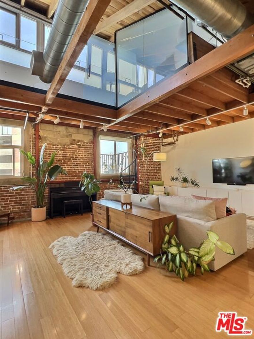 Rare two level character loft in the Molino Street Lofts with private patio and skyline views! Exposed brick, vaulted wood beamed ceilings, wood floors. Quality, uniqueness and charm abound! Situated in the center of the Arts District, a short distance to the many neighborhood restaurants, bars, coffee shops and boutiques; including Manuela at Hauser Wirth, SoHo Warehouse, Bavel, Bestia, Girl and The Goat, Kodo and Verve Coffee. Close to USC, SCI-Arc, Arts District dog park, and transportation. Come fall in love!