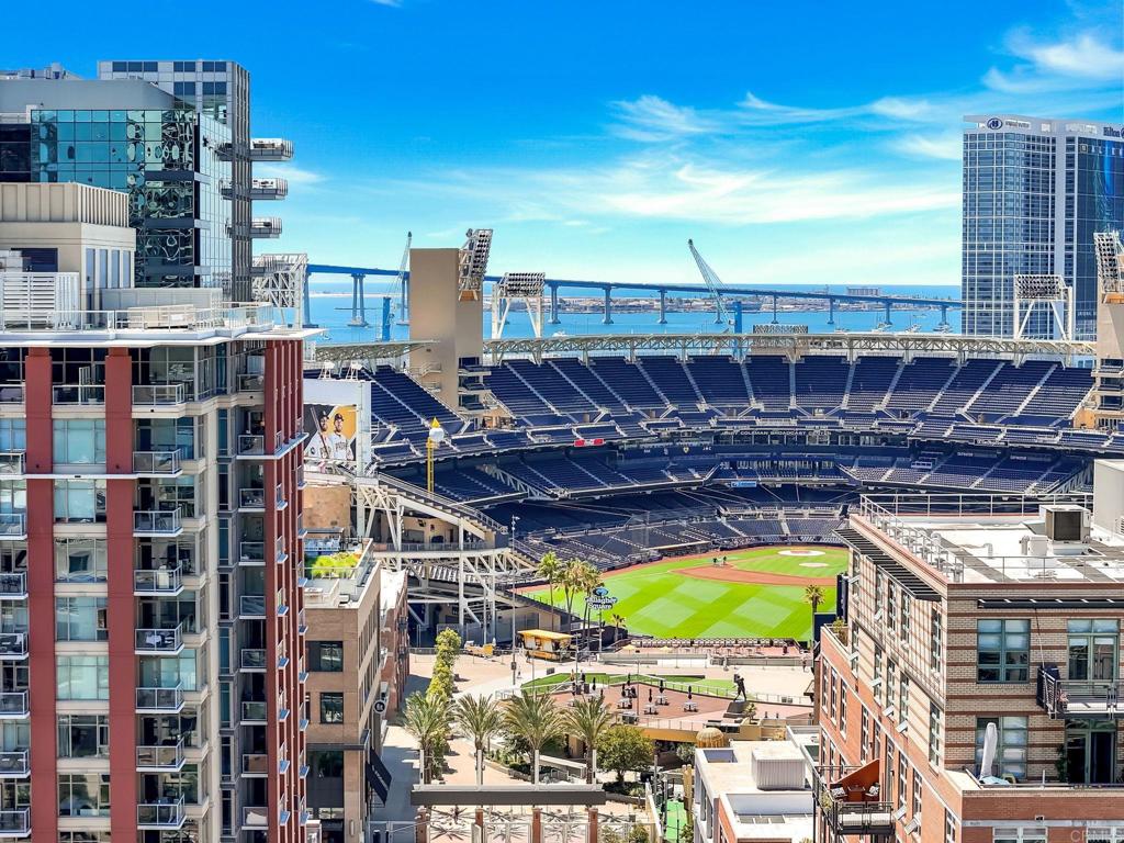 Front row living in Downtown East Village with Petco Park Views! Experience the ultimate urban lifestyle in this spacious 1-bedroom, 1-bathroom condo located in the heart of East Village. Enjoy direct views into Petco Park, perfect for baseball super fans, concert lovers, and anyone who craves the vibrant downtown San Diego lifestyle. This bright and airy unit features large windows that flood the space with natural light, granite countertops throughout, and ample storage, including two closets and a separate storage unit in the parking garage. The private patio offers incredible views right into the ballpark—your own personal spot for game day excitement! Additional highlights include: Secured entry building, assigned parking space in a secured garage, in-unit full-size LG washer and dryer, Samsung kitchen appliances, and rooftop lounge with impressive views of Petco Park. With unbeatable walkability to dining, shopping, nightlife, and easy access to public transportation, this home puts the best of America's Finest City right at your doorstep.