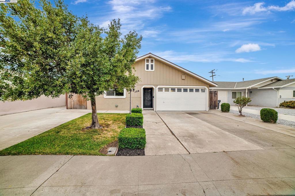 Welcome to 358 E 21st Street– Where Comfort Meets Convenience! This beautifully maintained 4 bed 2.5 bath single-family home is nestled in the heart of Tracy, offering the perfect blend of spacious living and modern charm. With an inviting layout, this two-story home is ideal for families, entertainers, and anyone looking for ample space and functionality. Step inside and you will be met with a spacious living room and dining area perfect for relaxing evenings or gatherings with loved ones. The updated kitchen boasts granite countertops, stainless steel appliances, and tons of cabinet space, while natural light fills every inch of the 3 large bedrooms with the bonus of an en suite bathroom. Upstairs, you will find a generous loft complete with its own half bath, walk-in closet, and balcony! Use it as a bedroom, den, home office, or anything else your mind can imagine! Enjoy the outdoors in the private backyard with BBQ grill, stove, and wet bar — ideal for hosting or simply enjoying the warm Summer days! Additional features include a 2-car garage, large storage, indoor laundry, central heating & air conditioning, and fresh carpet and paint throughout. Located near schools, parks, shopping, and easy freeway access. Welcome home!