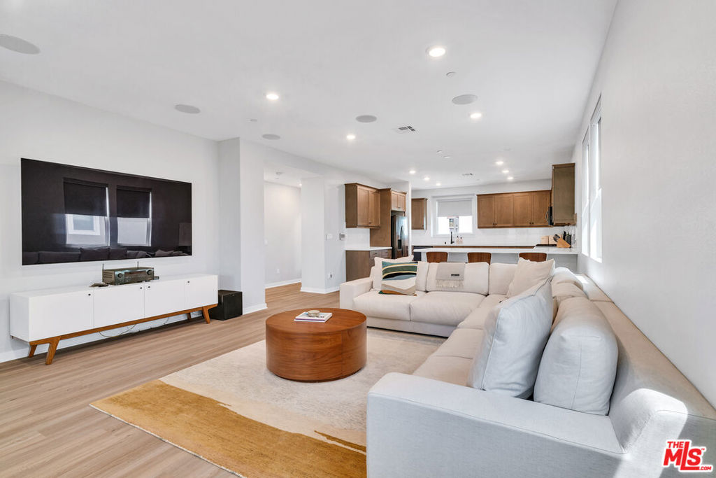 Located in the newly constructed development of Grace Park, this freestanding home was professionally designed with thoughtful detail. Three spacious bedrooms are located upstairs with two full baths. The middle floor showcases a gorgeous open concept kitchen with high-grade appliances and finishes. The massive living room and dining area are ideal for large gatherings and entertaining. The home boasts, central AC & heating, full size washer and dryer, recessed lighting throughout, luxury vinyl floors in the living areas and plush carpeting in the bedrooms & stairs for added comfort. The first floor offers a large bedroom with a walk-in closet and full bath. Enjoy the patio, clubhouse, pool, gym and grounds as you stroll within this gated community. Enjoy the redeveloped community which is in close proximity to freeways, eateries, shopping centers, coffee shops, the new SOFI Stadium, Hollywood Park Casino, Space-X, Forum and so much more. ***Furnished option available: $8,500/month.