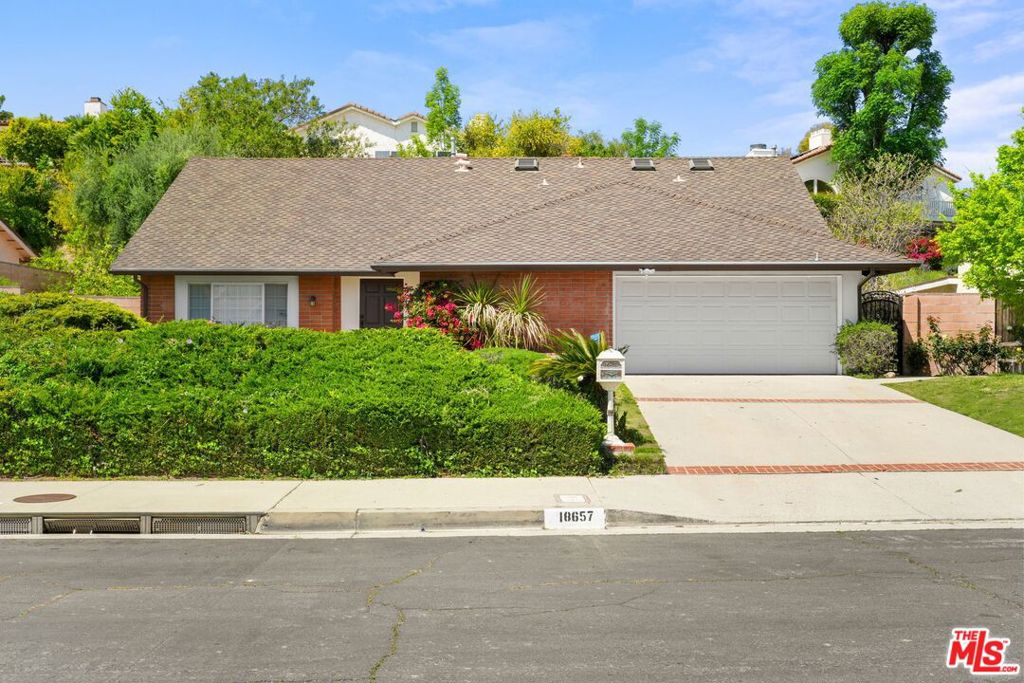 Step into this beautifully updated home, nestled in the highly coveted and charming neighborhood of Porter Ranch. Offering nearly 2,600 square feet of thoughtfully designed living space, this residence boasts an open floor plan that blends modern elegance with timeless appeal. The bright and airy living room is bathed in natural light, creating a warm and inviting atmosphere that seamlessly flows into the formal dining area perfect for both relaxing and entertaining. The spacious kitchen features an abundance of cabinetry and opens up to the family room, making it an ideal space for gatherings. With one bedroom conveniently located on the main floor, and additional bedrooms upstairs, this home provides ample space for the whole family. The oversized primary suite is a true retreat, overlooking the serene backyard and offering a peaceful escape at the end of the day. Set on a generous lot, this property is an outdoor oasis, complete with a relaxing spa and lush green lawn perfect for enjoying California's beautiful weather. Don't miss out on this stunning, renovated home in a prime neighborhood. It's the perfect blend of comfort, style, and luxury, in a truly enviable setting.