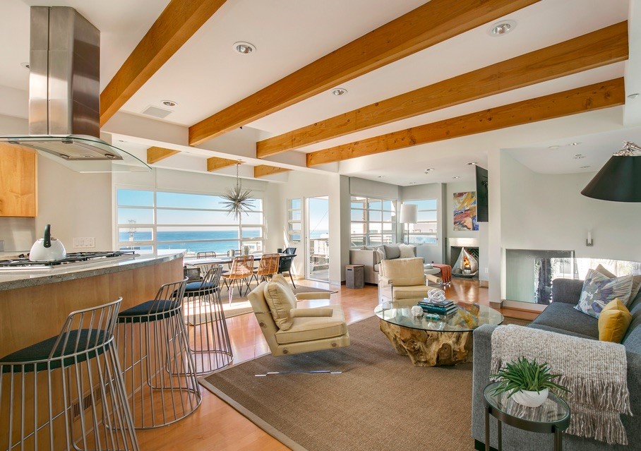 AVAILABLE AUGUST 15, 2025. This Stunning Classic Modern Town Home in the sweet spot of the Manhattan Beach South Sand Section is the seventh home from the Beach and a short walk to Downtown shops and restaurants. Open, light, airy floor plan features 2,090 sq ft of thoughtfully designed living space with 3 Bedrooms, 3.5 Baths, high open-beam ceilings, dramatic lighting, and a THREE-TOP ELEVATOR. Top-of-the-Line Kitchen Materials and Stainless Steel Appliances including Thermador cook top, hood and ovens with built-in combo microwave, Miel dishwasher, built-in coffee maker, Subzero refrigerator/freezer, Indian Ghibli granite counter tops with stainless steel back splash, and a Sky Window with recessed lighting. High Quality Maple Hardwood Floors and Cabinetry throughout. On cooler nights, enjoy the Gas Fireplaces with Lagos Azul Limestone hearths in the Living Room and the Master Suite. The luxurious Master Suite is like being in your own private spa with lounging bench, gas fireplace, whirlpool spa, steam shower, and adjoining walk-in closet with built-in dresser. Other features include HEPA and Ultraviolet Light Air Filtration System, water filtration system, Four Decks with Gas, Water, Large Whirlpool Spa and Wired for Sound, Two-Car Garage plus shared guest parking. UNOBSTRUCTED PANORAMIC OCEAN, WHITE WATER, SAND and PIER VIEWS. LONG-TERM LEASE PREFERRED.