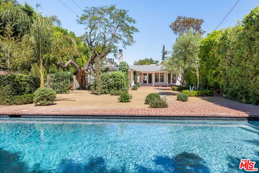 Designer-done single-level Traditional with expansive backyard and pool in coveted Toluca Lake location and city of Burbank services. This 3 bedroom + 3 bath home + bonus room / office and with guest house showcases wide-plank oak floors throughout, multiple fireplaces, custom built-ins, and a chef's kitchen with top-of-the-line appliances. The outdoor living is exceptional: a deep, private yard wrapped in mature landscaping, a sparkling pool set back for maximum privacy, an outdoor kitchen, and multiple patio areas perfect for entertaining. All just minutes from Whole Foods, The Studios, and the shops and restaurants of Toluca Lake, Studio City, and​​‌​​​​‌​​‌‌​​‌​​​‌‌​​​‌​​‌‌​​​‌​‌​​​‌‌​ Burbank.