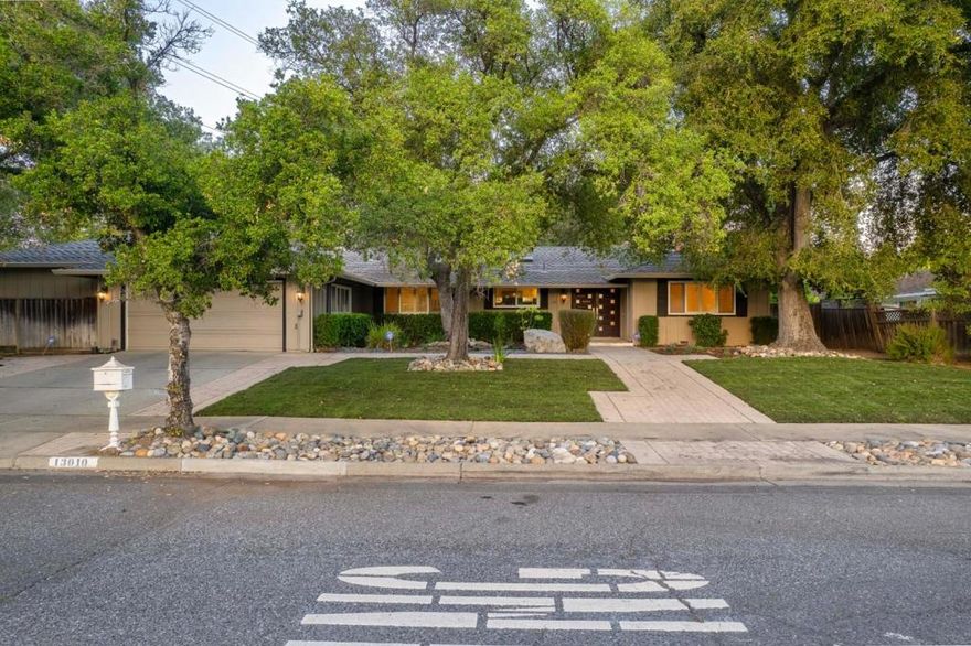 Welcome Home - Nestled in the heart of Saratoga's coveted Golden Triangle, 13010 Glen Brae Dr offers a rare blend of timeless elegance, thoughtful upgrades and undeniable comfort. This beautifully maintained 4-bed, 3.5 bath home spans 2,812 SqFt and sits on an expansive 14,033 SqFt flat lot - an exceptional combination of space, privacy, and convenience in one of Silicon Valley's most desirable neighborhoods.  From the moment you arrive, the homes charming curb appeal sets the tone. Step inside, and you're greeted by warm hardwood floors and abundant natural light pouring through skylights and generously sized windows. The layout flows gracefully, offering both open-concept gathering spaces and cozy retreats perfect for quiet evenings or hosting guests. At the heart of the home is the gourmet kitchen, tastefully updated with granite slab countertops and stainless-steel appliances - a dream for the home chef. Adjacent, the dining and family rooms invite connection, each space anchored by a fireplace and framed by views of the serene backyard. The primary suite is a sanctuary of comfort, featuring a spa-inspired bathroom and generous closet space. Three additional bedrooms, each well-proportioned, accommodate family, guests, or the flexibility to create a home office or media room.