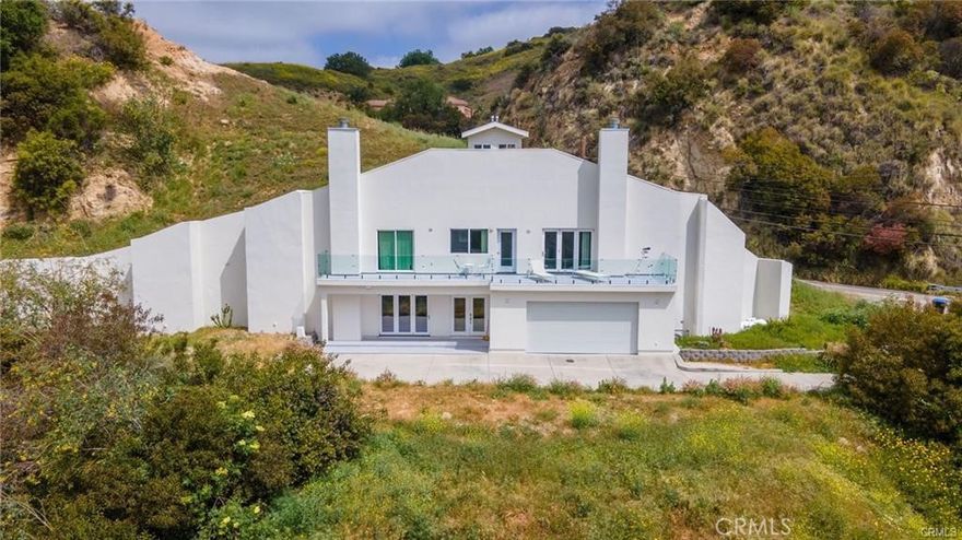 Amazing Rental opportunity awaits! New Build, Amazing home, One of the most unique and eco-friendly homes in Los Angeles County. This dome home is built into the hills with beautiful mountain and canyon views. The home is extremely sustainable and highly resistant to earthquakes, fires and floods. Master has stunning views, fireplace, balcony, and large walk-in closet as well as 2 additional closets. Master bath with soaker tub and separate shower wired for steam. Two additional bedrooms upstairs, both with views. Kitchen with center island, 3 sinks, dual source oven, with pot filler, and huge walk-in pantry. Theater room/family room with bathroom.