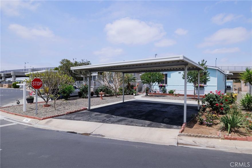 Beautiful Newer 3 bed 2 Bath Home in a Resort Like 55+ Community.  

This 2000 model home has a great open floor plan and spacious rooms.  New paint, flooring, counters...it is just beautiful.   The finishing touches are modern and gorgeous!  You must see this one!  It even has dual paned windows throughout.   The carport sets in the front of the home with side by side parking and a beautiful landscaped yard.  This home has a large covered deck and a nice sized rear yard.  Close to all the park amenities such as the pool, spa, billiard room, and fitness center.  Come by for a tour of this gorgeous home and the park amenities!