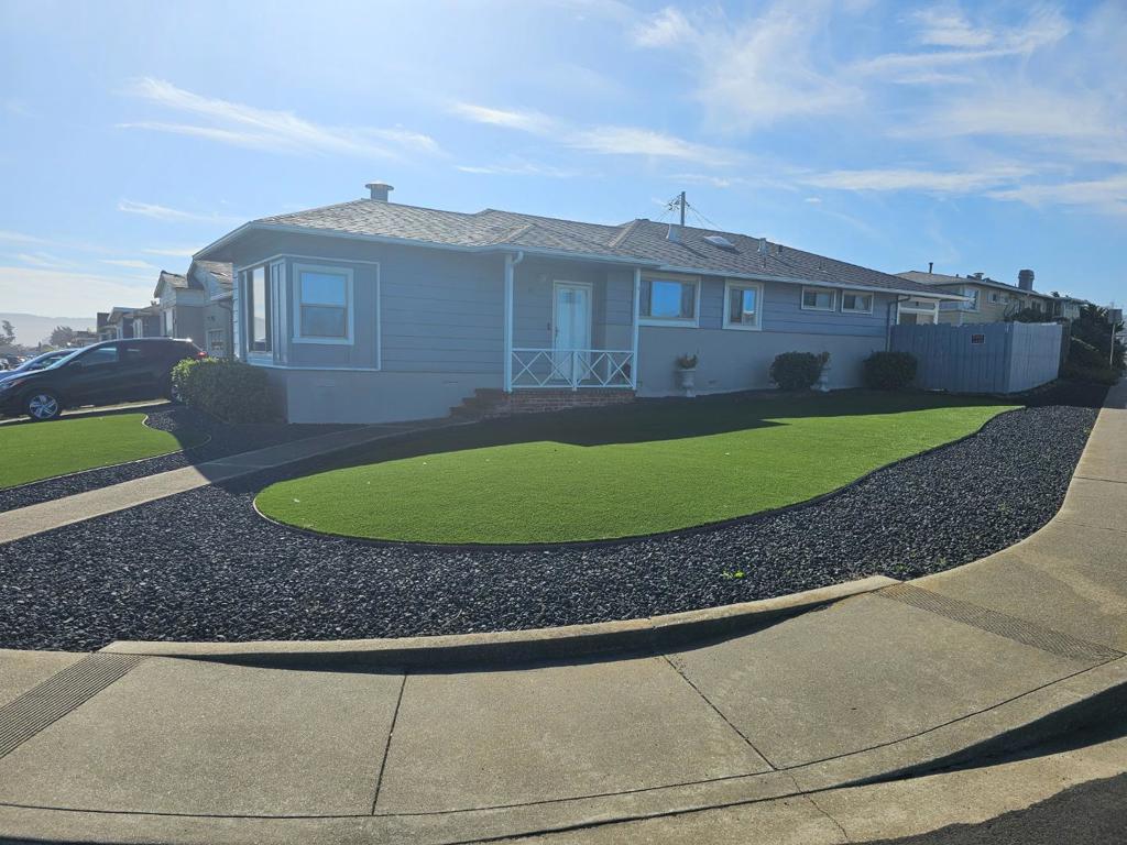 Welcome to this charming home in Daly City, offering 1,180 sq. ft. of comfortable living space. This house features three bedrooms, including more than one bedroom conveniently located on the ground floor, and two full bathrooms equipped with a shower and tub, and tile finishes. The kitchen is well-appointed with modern amenities such as an electric cooktop, formica countertops, dishwasher, garbage disposal, hood over range, and refrigerator, complemented by a skylight that bathes the area in natural light. Enjoy meals in the dining area, seamlessly integrated into the living room, which boasts a cozy fireplace for added warmth and ambiance. The home features a combination of carpet and hardwood flooring, providing a versatile and appealing aesthetic. Central forced air heating ensures comfort throughout the cooler months. The property includes a two-car garage with laundry facilities conveniently located inside. This residence is situated within the Jefferson Elementary School District. With its practical layout and desirable amenities, this Daly City home is ready to meet your needs.