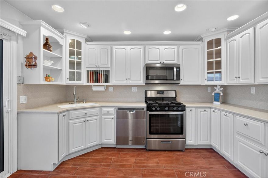 Freshly painted end unit with a beautifully updated kitchen, this single story home has much to love. It features two primary bedrooms, each with its own en suite bathroom and walk-in closet. One bathroom has a walk-in shower, the other has a shower in tub. 



Vaulted, scraped ceilings and recessed lighting set this home apart. The kitchen has been remodeled with updated cabinetry, countertops, and appliances (replaced within the last four years). This kitchen has lots of storage. Off the kitchen is one of two patios perfect for al fresco dining and entertaining. 



Big-ticket items have been taken care of, too — a new HVAC system within the last five years and a new roof installed just three months ago give you peace of mind.



Outside, you’ll find two patios, one covered patio off the living room has low-maintenance turf, the other off the kitchen connects to the garage. An additional parking spot is next to the garage. 



Magnolia Glen has an association pool. 



Less than one mile to I-15, grocery stores, Starbucks, restaurants, and public transportation.