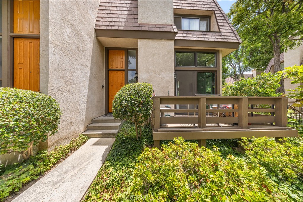 Welcome to this stunning tri-level End unit with only 1 common wall townhome in the coveted Northbrook community, offering 2 bedrooms, 2.5 bathrooms. The living room impresses with floor-to-ceiling windows, an abundance of natural light and open to your private outdoor patio, laminate flooring. The formal dining area with a wet bar and ceiling fan. Kitchen with New stainless gas stove an range hook. Large master bedroom featuring a spacious walk-in closet, a ceiling fan. The second bedroom has its own private bath. Two car attached garage offers direct access, and a Tesla EV charging outlet. New Central A/C system. Enjoy resort-style amenities, including three spas, a large pool, and tennis courts. Conveniently located near shopping, dining, public transportation. HOA covers earthquake insurance, water, and 24-hour security. Don't miss your chance to make this your new home!