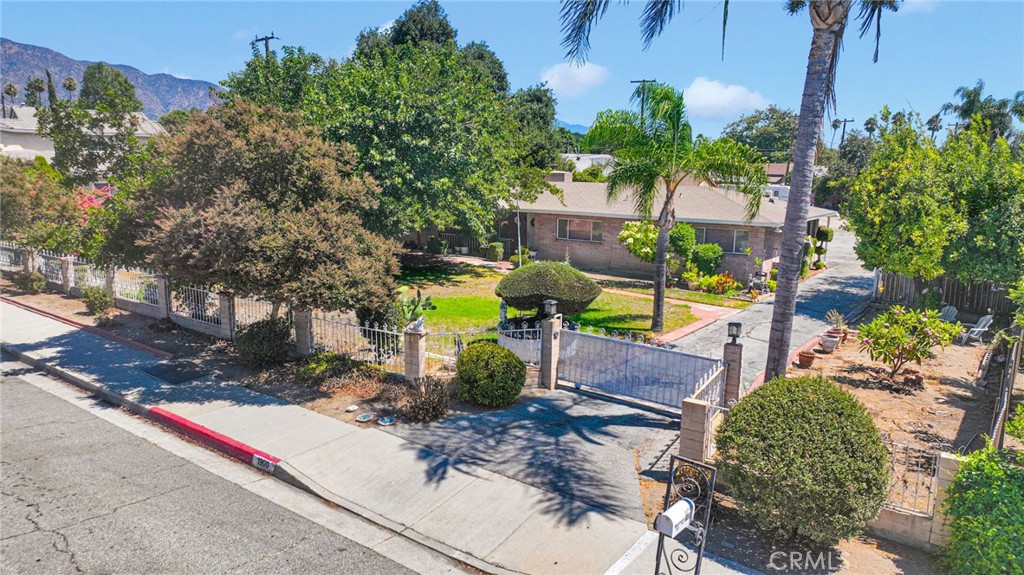 Rare opportunity in Duarte! For the first time in decades, 1900 S. Mountain Avenue is available. This property offers endless potential on one of the largest lots in the neighborhood.
The main residence features 3 bedrooms, 2 bathrooms, and 1,660 sq. ft. with a spacious floor plan that includes an indoor laundry room. Set on a massive 27,400+ sq. ft. lot (0.63 acres), the grounds are fully fenced with an automatic entry gate and boast mature landscaping, including fruit-producing lemon and orange trees.
A detached bonus studio with full bath and kitchen setup provides flexible options for guests, extended family, office, or rental potential (not included in recorded square footage).
Oversized parcels of this scale are rarely available, making this an ideal opportunity for investors, developers, or visionaries seeking expansion, multiple units, or the chance to create a one-of-a-kind retreat.
Conveniently located near schools, shopping, freeways, and the foothills of the San Gabriel Mountains, this property offers both immediate livability and long-term upside.