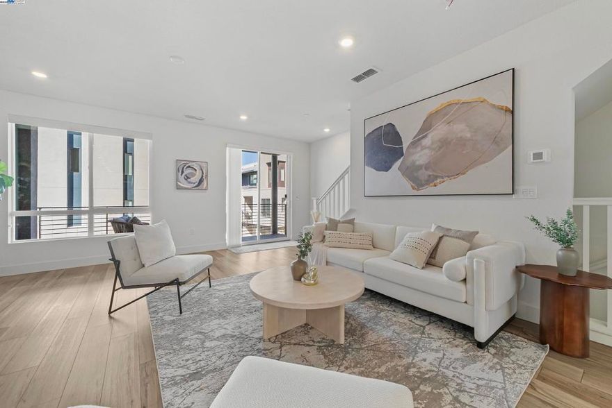 Welcome to a modern haven in the heart of Fremont! This exquisite townhouse at 3285 Internet Common, Unit 1005, offers a smart layout that perfectly balances style and functionality. Spanning 2,297 square feet, this spacious home features four generous bedrooms and four bathrooms, ensuring ample space for everyone. The main level boasts a convenient bedroom and bathroom, ideal for guests or a private home office. The open-concept kitchen seamlessly flows into the covered patio, creating a perfect setting for both indoor and outdoor entertaining. With owned solar panels, this home is not only beautiful but energy-efficient. Located near the Warm Springs BART station, the residence also offers easy access to major highways 680 and 880, making commute a breeze. This townhouse is situated in a vibrant neighborhood, known for its convenient location and modern amenities. Enjoy the community amenities, including a park, clubhouse, and swimming pool. For those who work at Tesla Fremont location, the proximity is unbeatable. Whether you're relaxing in the spacious living areas or enjoying the community features, this home offers a lifestyle of comfort and sophistication. Don't miss the opportunity to make this exceptional property your own.