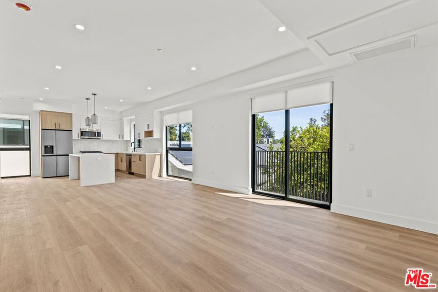 Experience upscale comfort and style in this brand new 4-bedroom, 4.5-bath townhome, ideally situated in vibrant Sherman Oaks. Thoughtfully designed for contemporary living, this stunning residence features a spacious layout, sleek finishes, and a massive private rooftop deck perfect for entertaining, relaxing, or soaking in city views.Step into a sun-drenched living room with soaring floor-to-ceiling windows that create an airy, open ambiance. The kitchen is a chef's dream, complete with gleaming quartz countertops, a striking island centerpiece, and premium stainless steel appliances.One en-suite bedroom is conveniently located on the main living level, ideal for guests or a home office. Upstairs, you'll find three more generously sized bedrooms, including a luxurious primary suite with dual sinks, a walk-in closet, and a glass-enclosed shower with built-in bench.Additional highlights include a private 2-car garage, in-unit laundry, and premium fixtures throughout. With its prime location near shopping, dining, and easy freeway access, this modern gem offers both luxury and convenience in one of LA's most desirable neighborhoods.