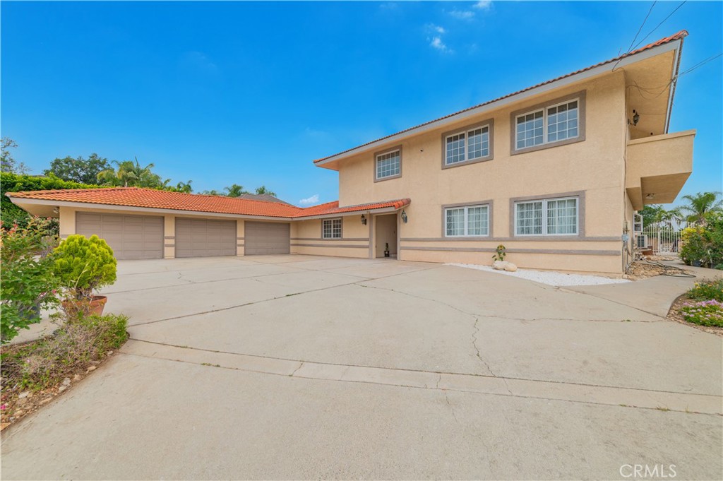 Located in a quiet secluded area of Turnbull Canyon, this thoughtfully remodeled home features 5 large spacious bedrooms and 4.5 bathrooms. Three of the bedrooms are located downstairs including one with its own en-suite bathroom. Also downstairs you will find an open spacious living room, formal dining area, game room, and large office. The dining area features new French doors that lead to the backyard where you will find a covered patio area that is great for entertaining. The entire front yard perimeter has iron gates recently installed for extra security and perfect for those with dogs or pets. You will also find a collection of thriving fruit trees dotted along the front yard including the guava, star fruit, kiwi, pomelo, lemon, passion fruit, plum trees and much more! Sellers have spent a significant amount on upgrades and also installed a 240V EV charging station outside. Upstairs on the second floor you will find an open spacious sitting area with plenty of natural light. Also upstairs are the two primary bedrooms both with en-suite bathrooms and walk-in closets. Enjoy the mountain vistas and view of the pool below from the balcony upstairs and don’t pass up on this gem of a home!
