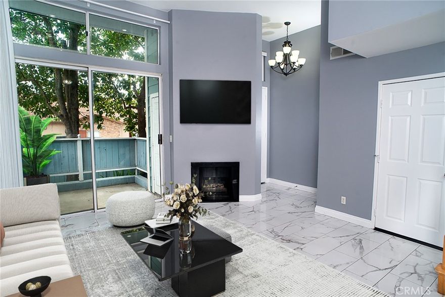 End unit with one neighbour attached, this townhome you will impress you with the high ceilings in the living room, tile flooring and the fireplace. Tall, sliding door to access the front patio. Dining room, overlooking the living room with tile floors will lead you to the kitchen, upgraded with quartz countertops and a breakfast nook. Laundry area conveniently located in the kitchen. 
Upstairs, brand new vinyl flooring through out. Master bedroom with vaulted ceilings, recently remodeled master bath and access to the balcony with the view of the tree branches that provide an amazing privacy. Guest bedroom with high ceilings and a full bath. This freshly painted unit offers daylight throughout the day. HVAC INSTALLED TWO YEARS AGO AND A WATER HEATER HAS BEEN INSTALLED SIX MONTHS AGO.