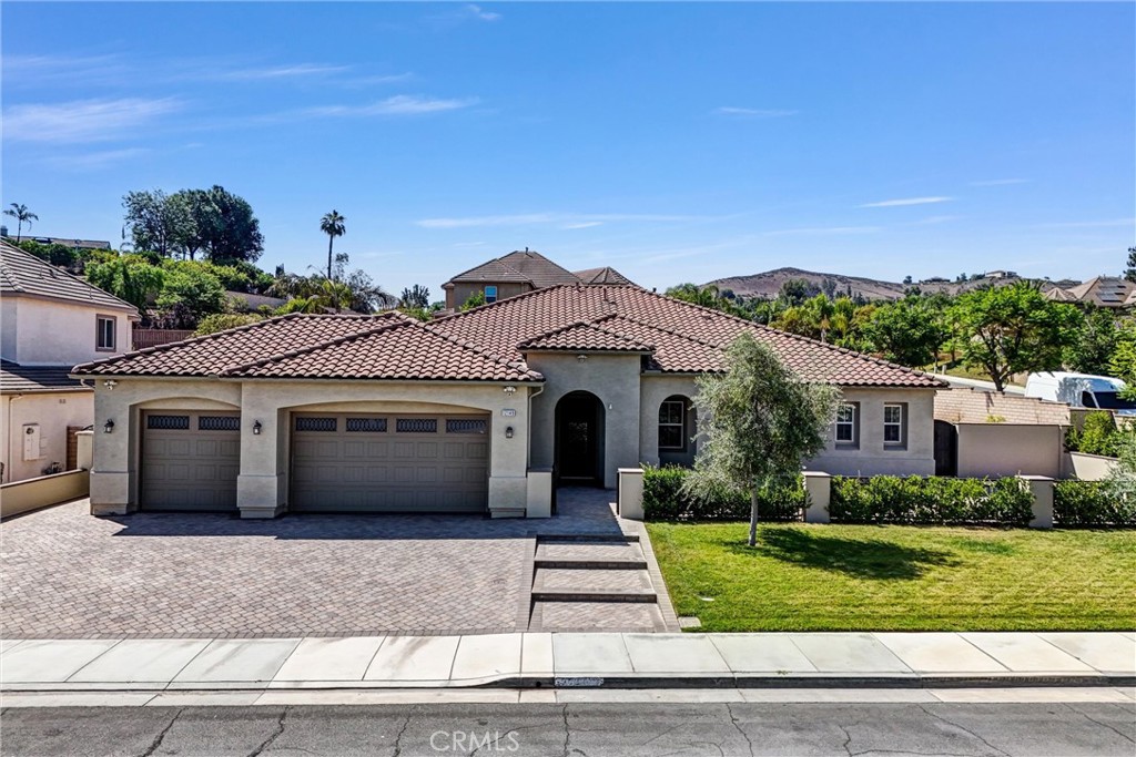 Executive Single-Story Luxury Living | 3,997 SF | Corner Lot Oasis
Every inch of this stunning executive home has been customized to perfection with luxurious designer finishes throughout. Situated on a premium corner lot, this expansive single-story residence offers nearly 4,000 square feet of refined living space, blending elegance, comfort, and functionality.
Step through the custom iron front door into a bright and open layout featuring wide hallways, large rooms, and an effortless flow between indoor and outdoor living. The gourmet kitchen is a chef’s dream with professional-grade appliances, an oversized island, designer cabinetry, countertops, and backsplash, overlooking a large family room with a built-in entertainment center and cozy fireplace.
The primary suite is a true retreat with private French door access to the backyard, a spa-inspired bathroom with soaking tub, walk-in shower, dual vanities, makeup station, and a dream walk-in closet. All secondary bedrooms are generously sized, including one that can easily serve as a second master with its own access to a dual-use hallway bath.
Highlights include:
• 3-car garage with epoxy flooring and built-in cabinetry
• Designer pavers on driveway and enclosed front patio
• Separate dining room, indoor laundry with sink and storage
• High-end chandeliers, custom ceiling fans, and wood trim throughout
• Smart home features, dual-zone HVAC, LED lighting, and surveillance system
• Water-efficient landscaping with premium turf
• Energy-saving windows, toilets, and thermostats
Step outside into your own resort-style backyard oasis featuring a saltwater pool and Jacuzzi with multiple waterfall features, tanning platform, covered patios, a cozy fire-pit, and fruit trees, all professionally designed for entertaining, relaxing, and enjoying the outdoors year-round.
This is not just a home, it’s a lifestyle. Meticulously upgraded with hundreds of thousands invested, this is the one you’ve been waiting for. Come see it in person and experience what true custom living feels like.