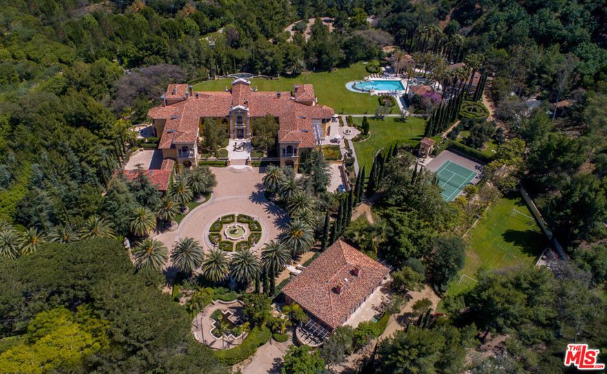 Located in Secure Gated and Guarded Beverly Park, Villa Firenze sits on 9.85 acres mostly flat and includes lots 67, 68 and 69 Beverly Park, probably priced at land value.   Gated Stone entry to one of the Great Estates of Los Angeles with Huge Massive Rooms and Acres of Private Grounds!   Large Motor Court with Central Fountain.   Stone steps to Main Villa with Massive Public rooms,  20' ceilings and Antique Stone Fireplaces.  Living Room overlooks acres of grassy yard.  Two story Rotunda Library/Office with secret passage to Master and Lavish Den w Bar.  Open Kitchen to Large Family Room with Screening and Fireplace.  Very Large Formal Dining Room plus family dining off of Kitchen. Upstairs, Huge Primary Suite with dual lavish Baths and live-in Closets each with a separate  office.  Five Family Bedrooms each with en-suite bath plus upstairs family/media Room.  Fully equipped Gym, gift wrapping room Library and more!  Across the Motor Court a Villeta Firenze, a Separate Guest House with two bedrooms with en-suite baths, Kitchen, powder room and Private Patio and Spa.  Lighted Tennis Court with extravagant stone seating area.  Separate Pool Compound consisting of 2 Bedroom Pool House, Cabana with Open Kitchen and entertainment area and Pool Baths and Dressing Rooms. Basketball half Court, Practice Soccer field, Child's maze and all surrounded by a wide jogging trail.  House Manager's and maintenance offices, workshop and endless storage.  Several parking lots plus motor court parking.  A Private and Complete Estate for those who value privacy and security!