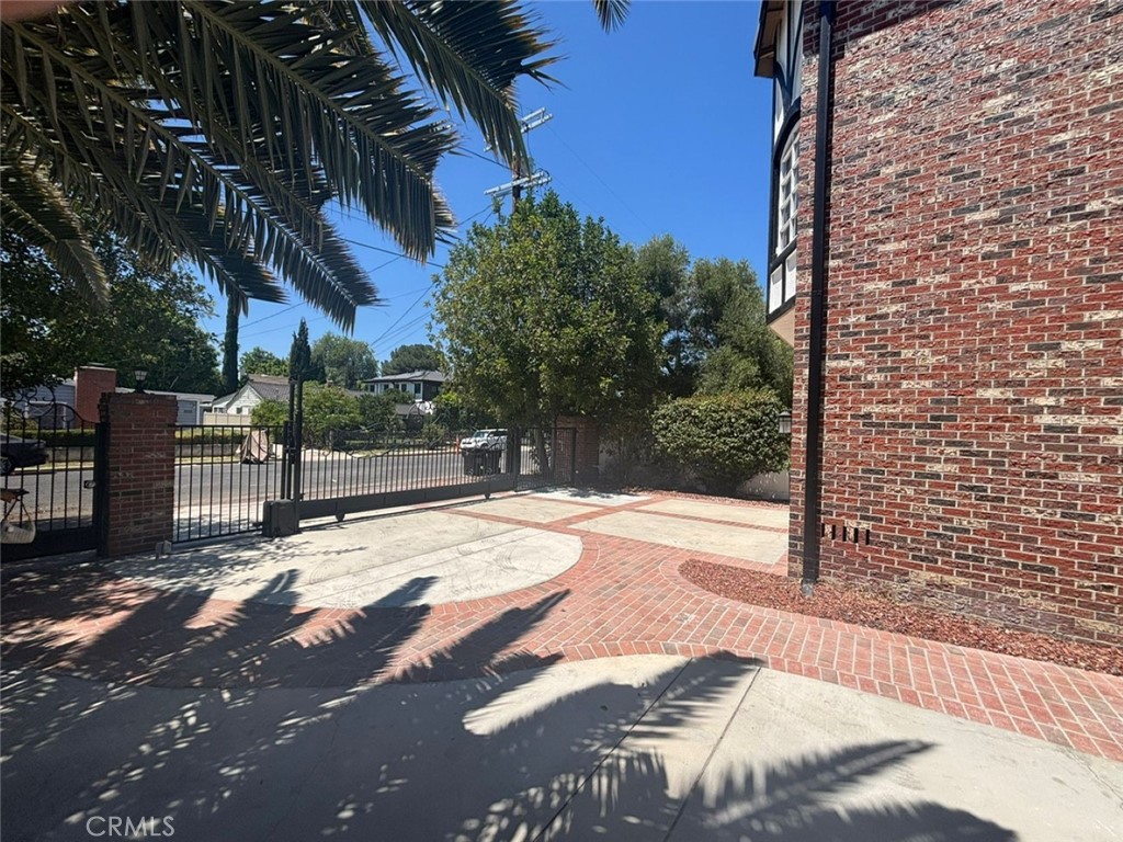 LOCATED SOUTH OF the Boulevard in a prime Tarzana neighbor hood, this beautifully remodeled 5-bed, 5-bath home offers over 4273 sq ft of elegant living space. A grand entry with soaring ceilings and light wood flooring leads to sun-filled interiors and open-concept living areas- Ideal for entertaining. The expansive layout includes a downstairs bedroom and four upstairs, each with large walk-in closets. The Luxurious 1200+ sq ft primary suite boats high ceilings, a fireplace, a private balcony, and a bonus room perfect for an office or gym. The spa-like master bath features a soaking tub, oversized shower, and dual walk-in closets. Enjoy seamless indoor-outdoor living with multiple fireplaces, formal dining, a Chef's kitchen , sparkling pool & spa, built-in BBQ, and a gated driveway with a 2-car garage and parking for 5+ . Equipped with security cameras for added peace of mind. this home blends luxury, space ,and location- near top dining, shopping ( Costco, Amazon, Trader joe's ,Whole foods, Topanga village) , parks, schools and the Ram's training facility. and more, don't miss it!