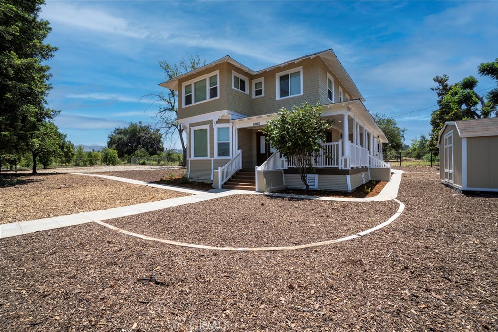 Beautiful Two-Story 4-Bedroom Historic Home in Redlands! This 100-year-old home was Fully Renovated last year and is located on a large lot in the Redlands orange groves. The covered wrap-around porch and upper-level Balcony offer lovely Mountain Views. Features include a Spacious Living Room, Dining Room with beautiful Built-in Cabinetry, an Office/Den, 4 Roomy Bedrooms, and 2 Bathrooms. The Upgraded Kitchen includes a Stove/Oven (gas), Microwave, Dishwasher, and Garbage Disposal. Near the Kitchen is the Laundry Room with a full-sized Washer and Dryer. Mini-Split Units provide Heat and AC. This home includes Newer Interior/Exterior Paint and Vinyl Plank Flooring throughout. There is a Large Covered Patio off the Kitchen, and the Spacious Fenced Backyard area includes a Storage Shed. Parking is on the property and street only. There is no covered parking. Gardening is Provided! Will Consider 1 Pet.